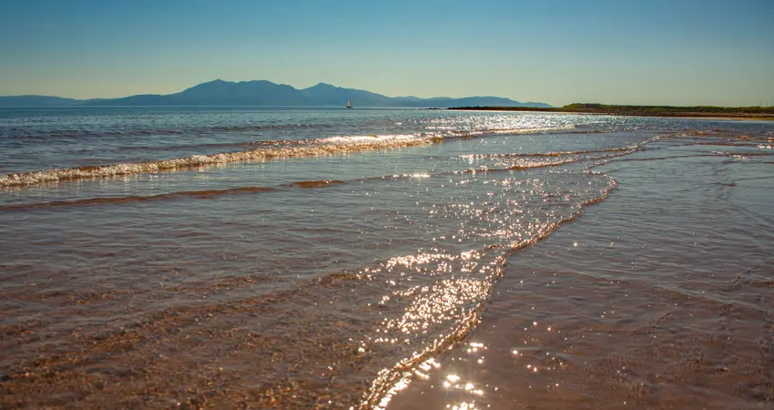 Portencross Beach in Ayrshire Scotland on a Sunny Summer Day with View to the Isle of Arran